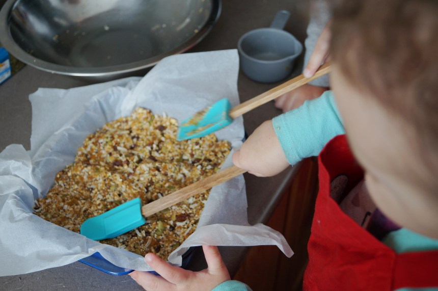 Pressing it down with their "hammer sticks".